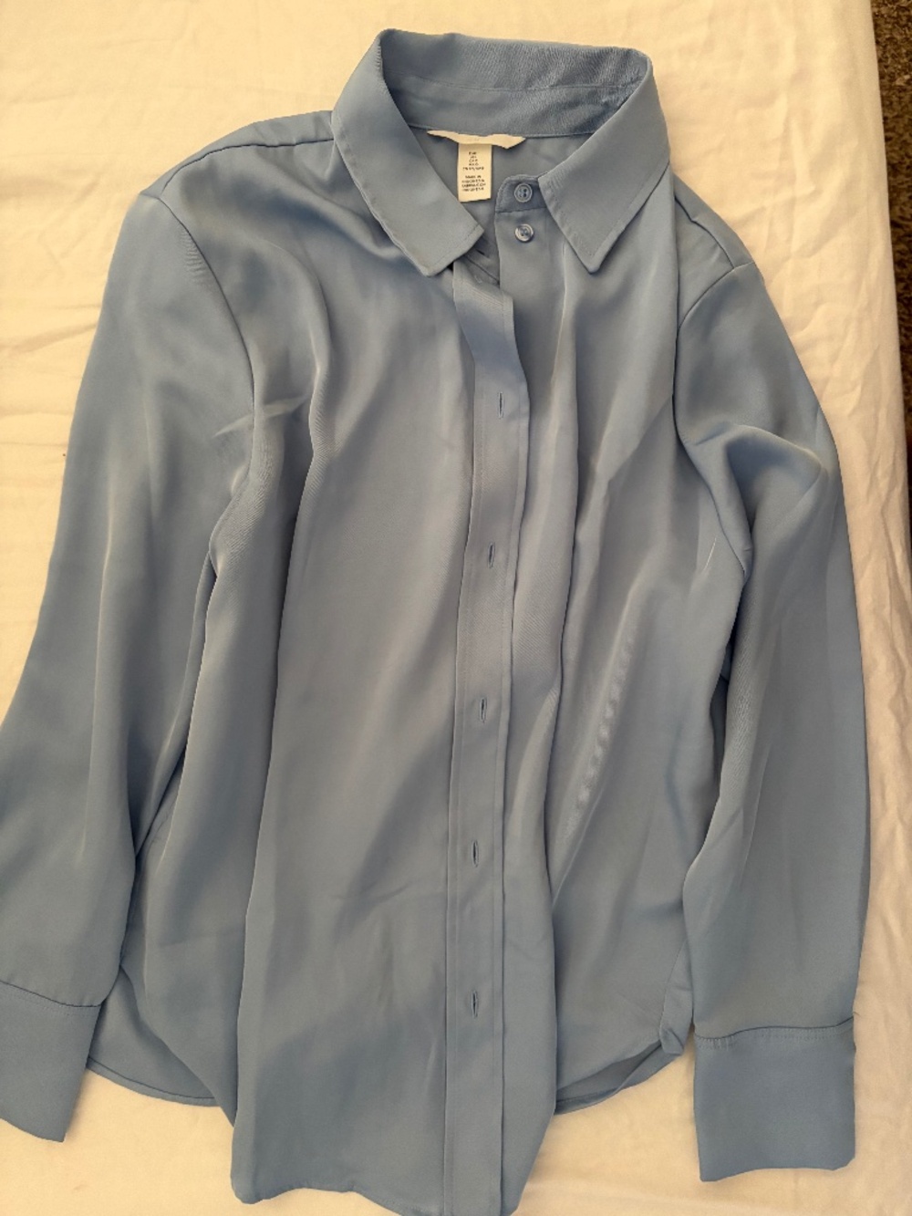 Available two H&M Button down blouses Sz L